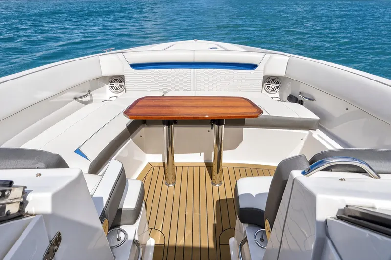 Slide: The Image of Luxurious 2022 Tiara Yachts 38 LX interior with elegant seating and wooden table. - 13