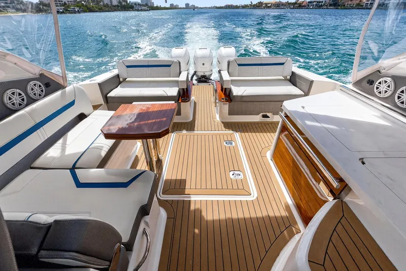 Slide: The Image of 2022 Tiara Yachts 38 LX interior with luxurious seating and ocean view. - 15