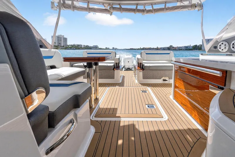 Slide: The Image of Luxurious 2022 Tiara Yachts 38 LX interior with elegant seating and scenic water view. - 16