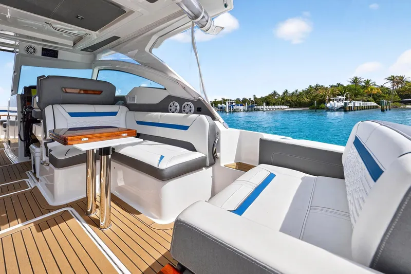 Slide: The Image of 2022 Tiara Yachts 38 LX interior with luxurious seating and ocean view. - 17