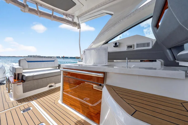 Slide: The Image of 2022 Tiara Yachts 38 LX interior with luxurious seating and sleek design. - 25