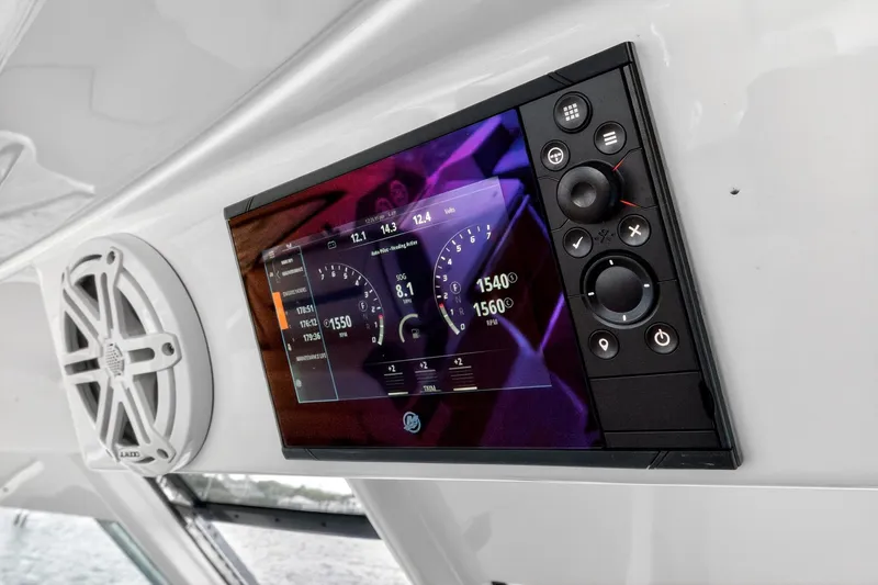 Slide: The Image of Dashboard of 2022 Tiara Yachts 38 LX with digital display and controls. - 29
