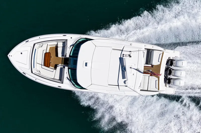 Slide: The Image of 2022 Tiara Yachts 38 LX cruising on water, aerial view. - 3