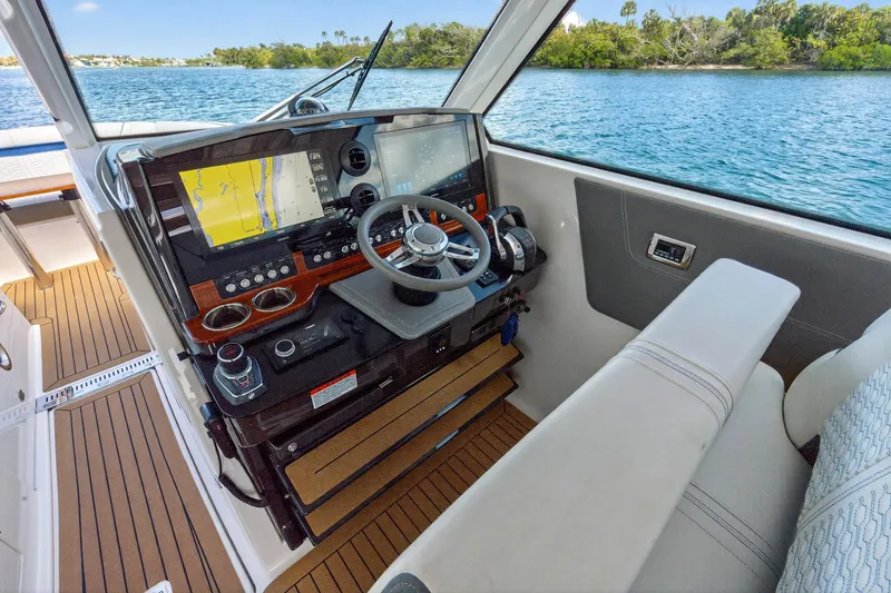 Slide: The Image of 2022 Tiara Yachts 38 LX helm with advanced navigation system and luxurious seating. - 31