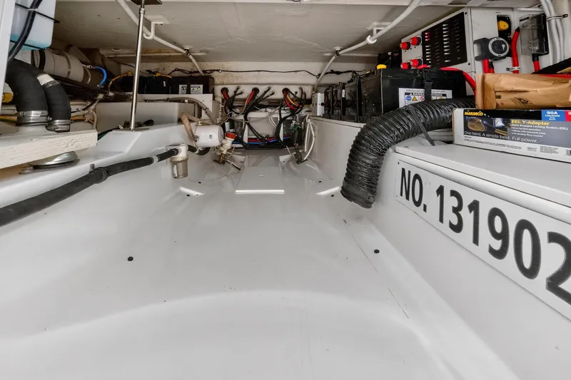 Slide: The Image of 2022 Tiara Yachts 38 LX engine compartment with wiring and equipment. - 34