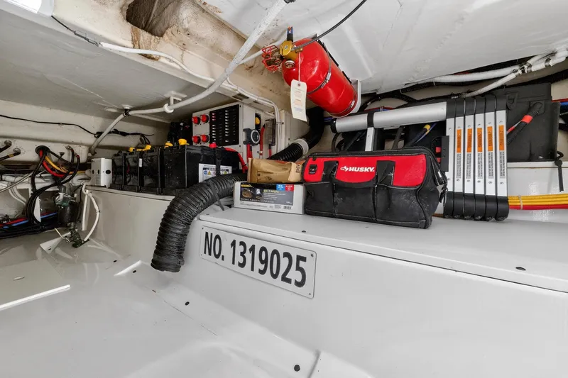 Slide: The Image of Engine compartment of 2022 Tiara Yachts 38 LX with tools and equipment. - 35