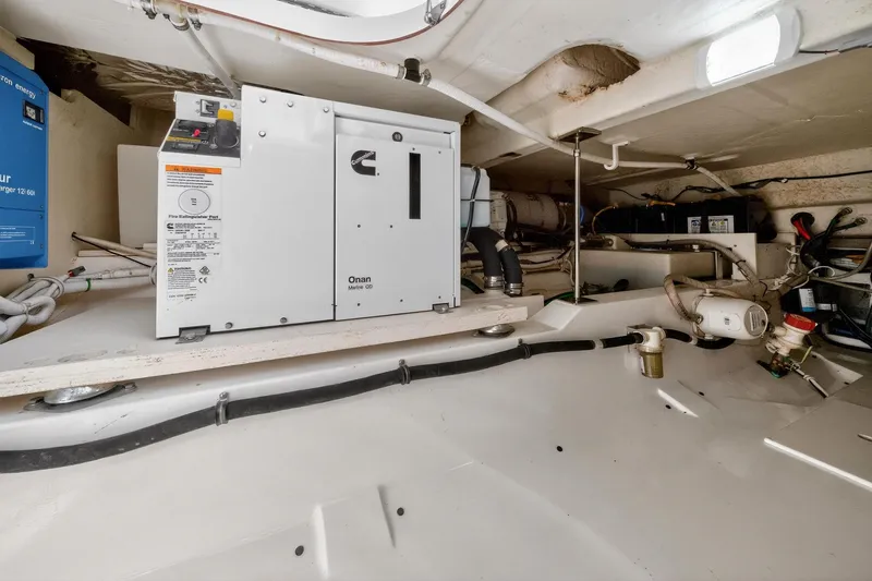 Slide: The Image of Engine room of 2022 Tiara Yachts 38 LX, featuring Onan Marine generator. - 36