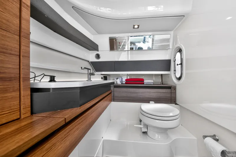 Slide: The Image of Luxurious bathroom interior of 2022 Tiara Yachts 38 LX, featuring modern fixtures and elegant design. - 38