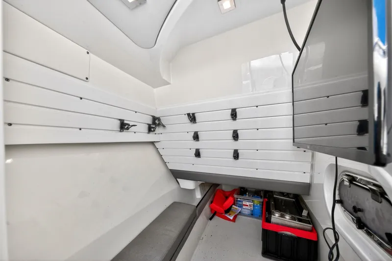 Slide: The Image of Interior of 2022 Tiara Yachts 38 LX, featuring storage and seating area. - 39