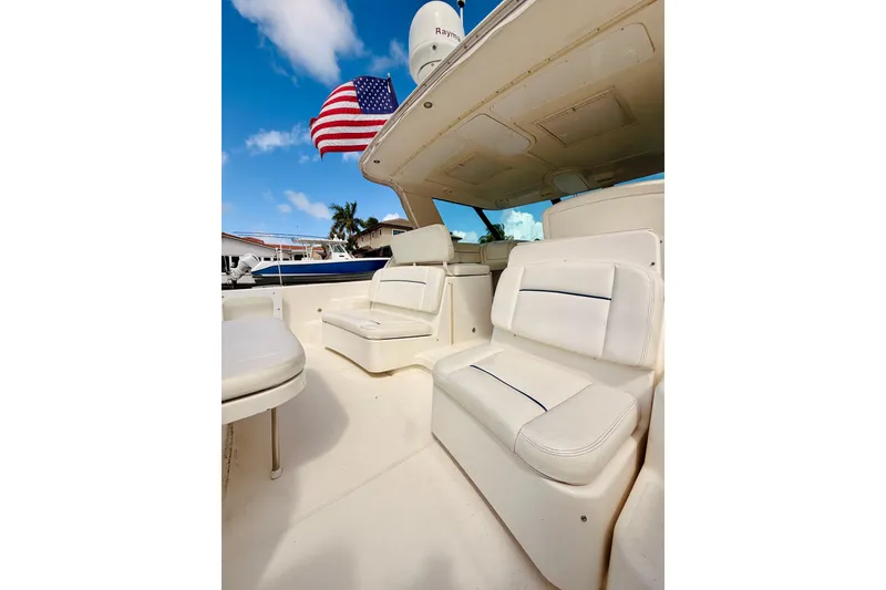 Slide: The Image of 2005 Tiara Yachts 3600 Sovran interior with white seating and American flag. - 17