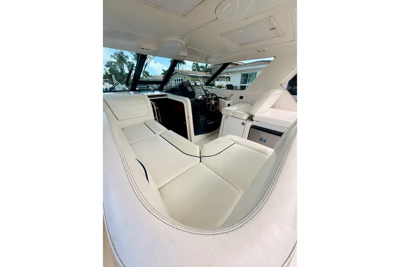 Slide: The Image of Interior view of 2005 Tiara Yachts 3600 Sovran, featuring luxurious seating and helm. - 22