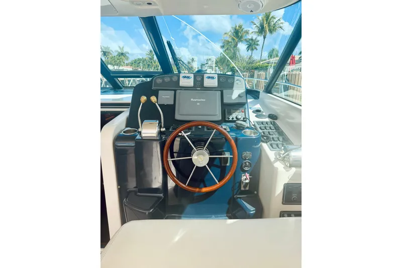 Slide: The Image of Helm of 2005 Tiara Yachts 3600 Sovran with steering wheel and navigation controls. - 29