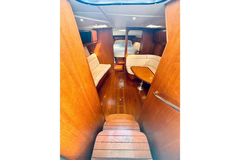 Slide: The Image of 2005 Tiara Yachts 3600 Sovran interior with wood finish and comfortable seating. - 33