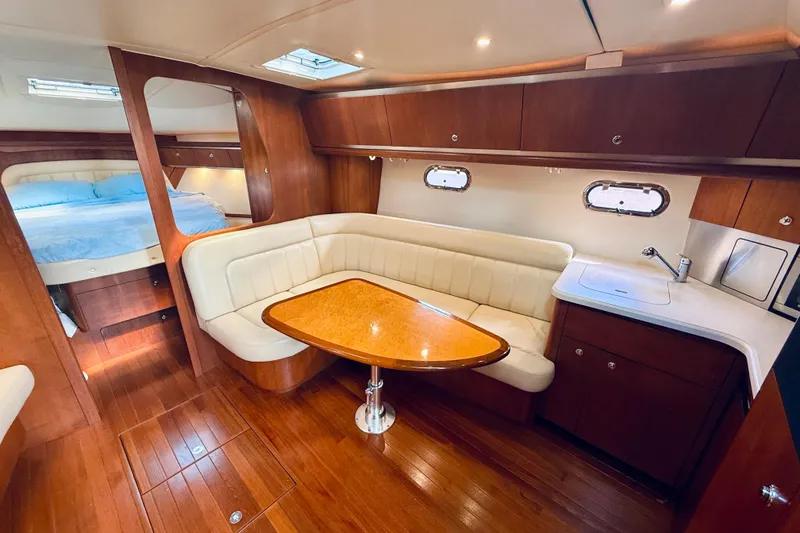 Slide: The Image of Luxurious interior of 2005 Tiara Yachts 3600 Sovran with wood finish and cozy seating. - 34