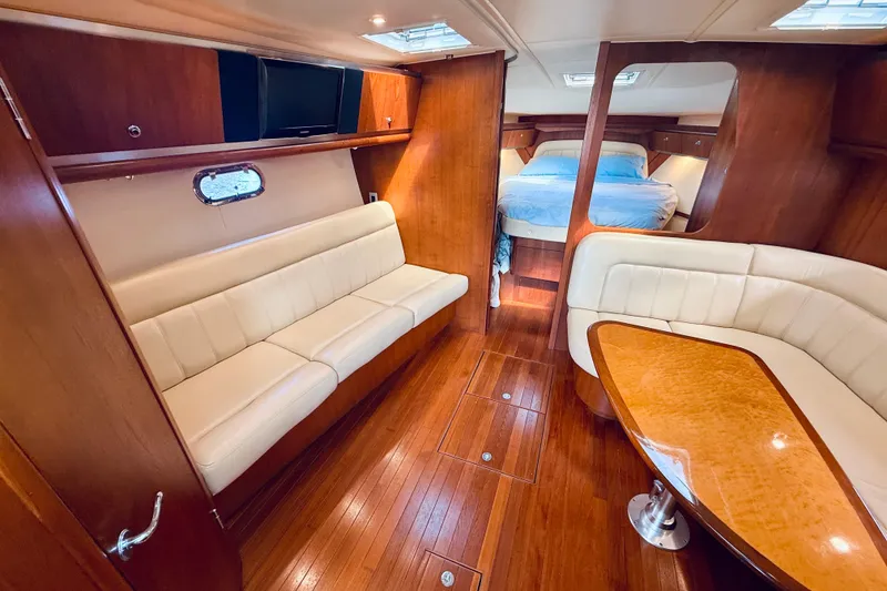 Slide: The Image of Luxurious 2005 Tiara Yachts 3600 Sovran interior with wood finish and comfortable seating. - 35