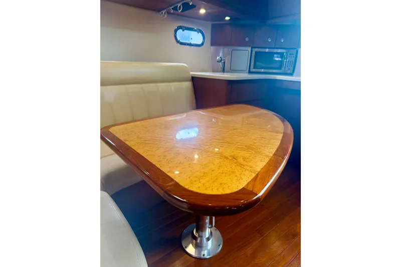 Slide: The Image of Luxurious interior of 2005 Tiara Yachts 3600 Sovran with elegant wood table and seating. - 37