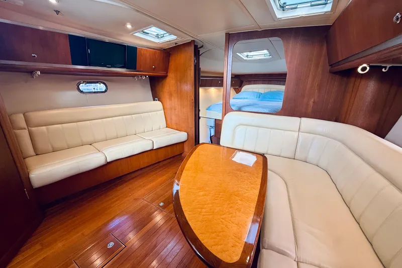 Slide: The Image of 2005 Tiara Yachts 3600 Sovran interior with elegant wood and leather seating. - 39