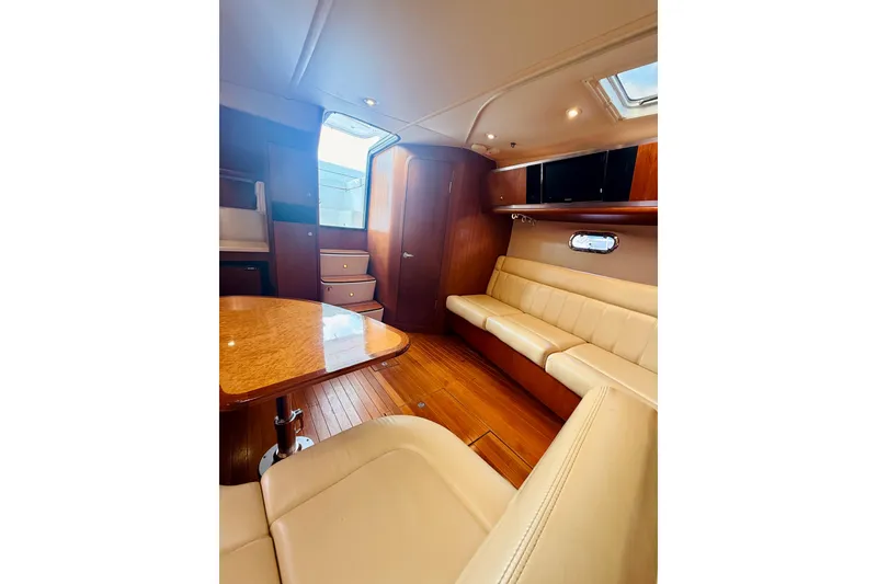 Slide: The Image of Luxurious interior of 2005 Tiara Yachts 3600 Sovran with elegant seating and wood finishes. - 42