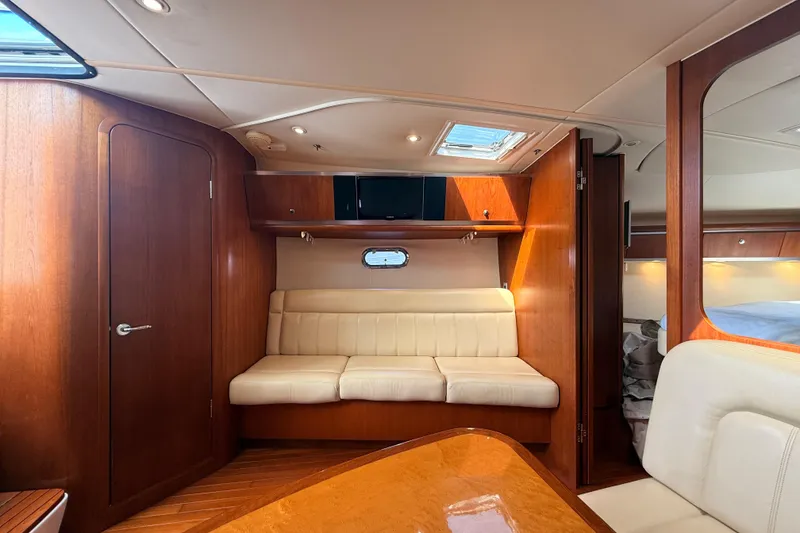 Slide: The Image of Luxurious 2005 Tiara Yachts 3600 Sovran interior with elegant wood and cream seating. - 45