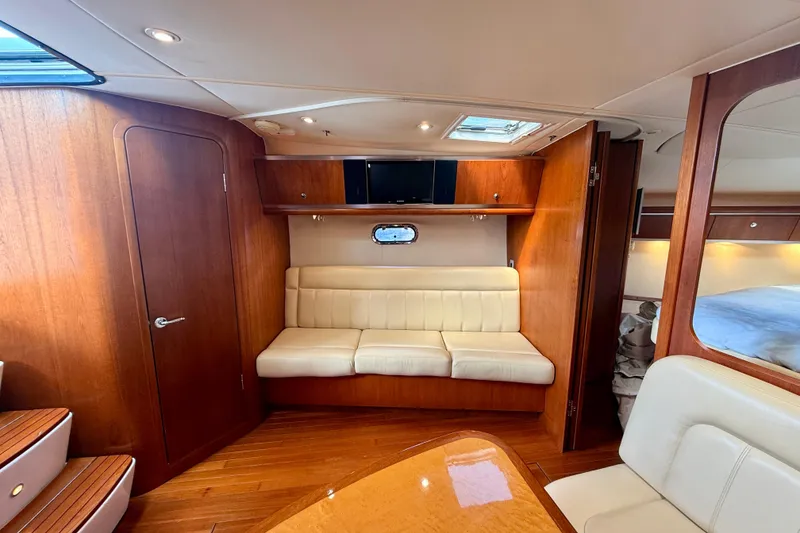 Slide: The Image of Luxurious interior of 2005 Tiara Yachts 3600 Sovran with wood finish and cream seating. - 46
