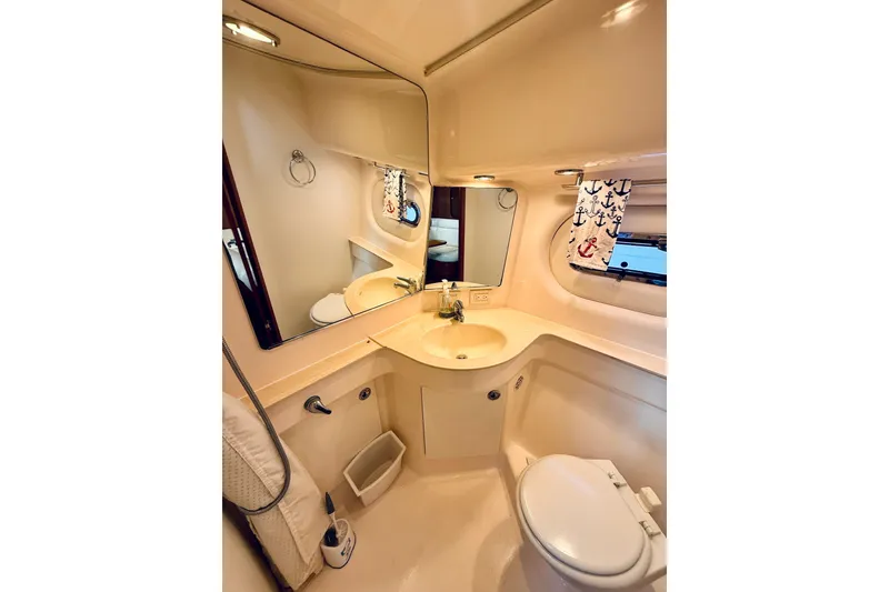 Slide: The Image of Luxurious bathroom in 2005 Tiara Yachts 3600 Sovran, featuring modern fixtures and nautical decor. - 48