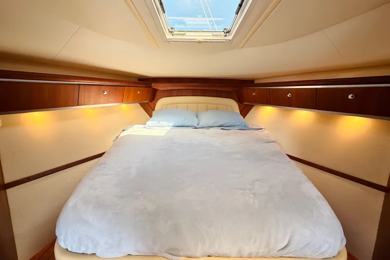 Slide: The Image of Luxurious cabin interior of 2005 Tiara Yachts 3600 Sovran with cozy bedding. - 50
