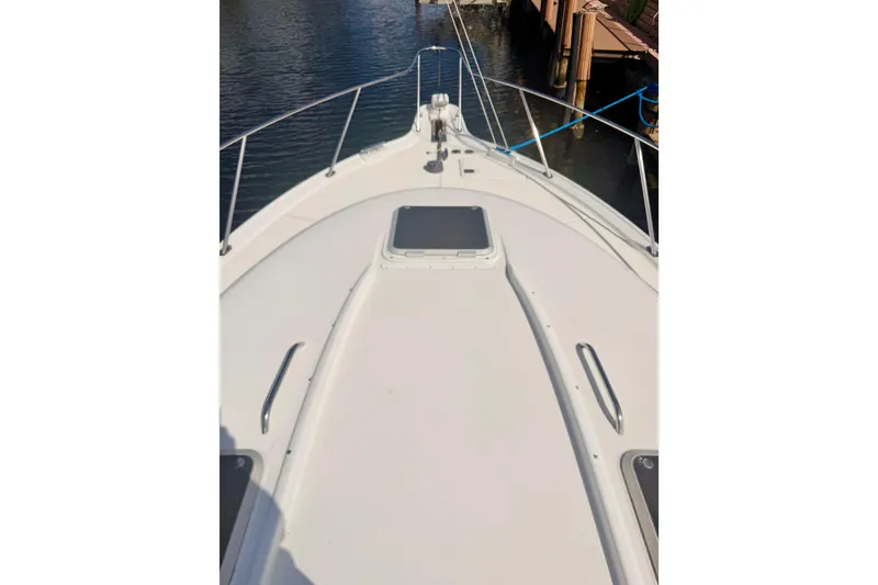 Slide: The Image of 2005 Tiara Yachts 3600 Sovran deck view, docked by the water. - 52