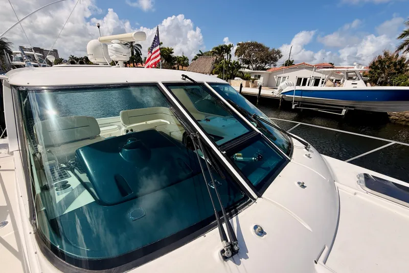 Slide: The Image of 2005 Tiara Yachts 3600 Sovran docked, featuring sleek design and spacious cockpit. - 59