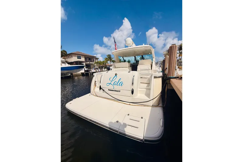 Slide: The Image of 2005 Tiara Yachts 3600 Sovran docked, featuring spacious deck and elegant design. - 6