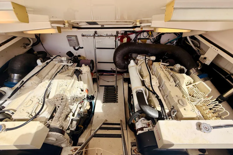 Slide: The Image of Engine room of 2005 Tiara Yachts 3600 Sovran with dual engines and mechanical components. - 64