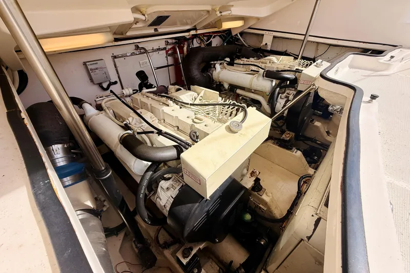 Slide: The Image of Engine room of 2005 Tiara Yachts 3600 Sovran, showcasing dual engines and mechanical components. - 65