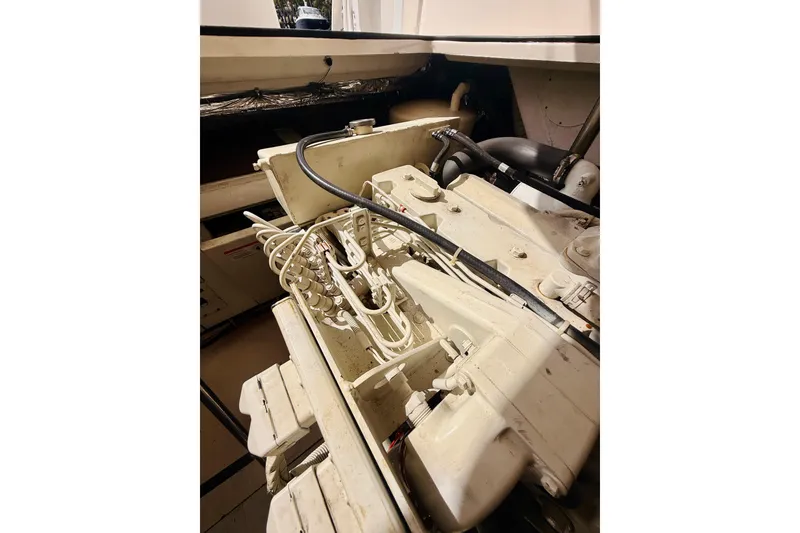 Slide: The Image of Engine compartment of 2005 Tiara Yachts 3600 Sovran, showcasing mechanical components and wiring. - 70