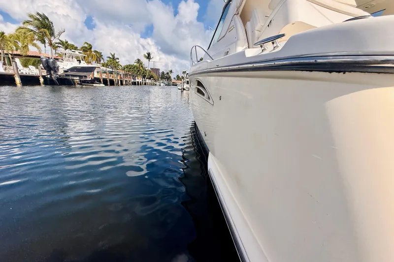 Slide: The Image of 2005 Tiara Yachts 3600 Sovran docked on a sunny day, reflecting on calm water. - 72