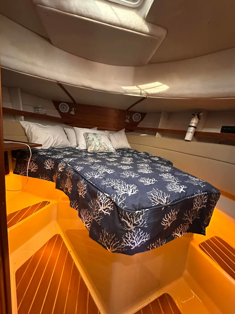 Slide: The Image of Interior of 2022 Ranger Tugs R-31 CB with cozy bed. - 10