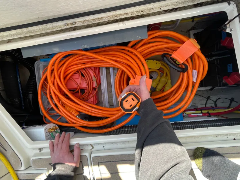 Slide: The Image of Electrical cables in storage compartment of a 2022 Ranger Tugs R-31 CB boat. - 19