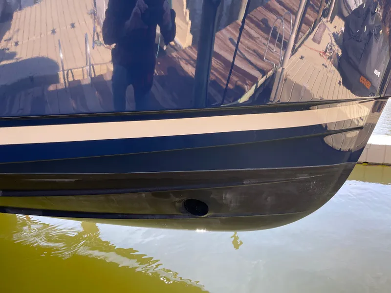 Slide: The Image of Ranger Tugs R-31 CB 2022 boat hull in water. - 3