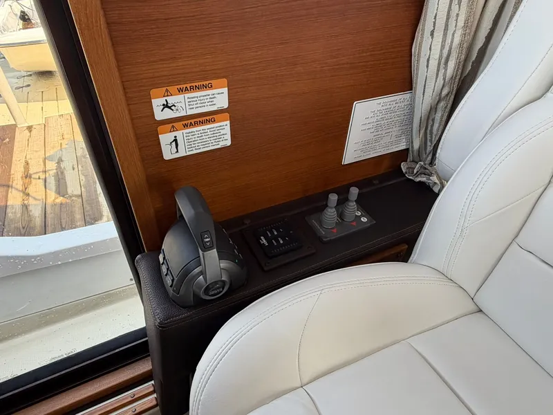 Slide: The Image of Interior of 2022 Ranger Tugs R-31 CB with control console. - 30