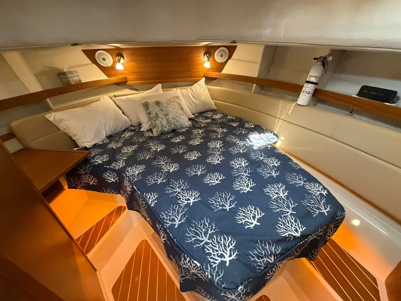 Slide: The Image of Interior of 2022 Ranger Tugs R-31 CB with cozy bed. - 40
