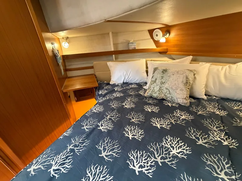 Slide: The Image of Interior of 2022 Ranger Tugs R-31 CB with cozy bed. - 41