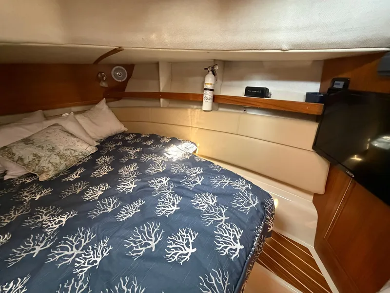 Slide: The Image of Interior of 2022 Ranger Tugs R-31 CB with cozy bed. - 42
