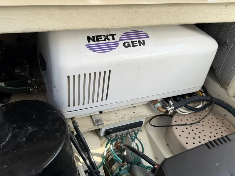 Slide: The Image of Engine compartment of 2022 Ranger Tugs R-31 CB with Next Gen generator. - 49