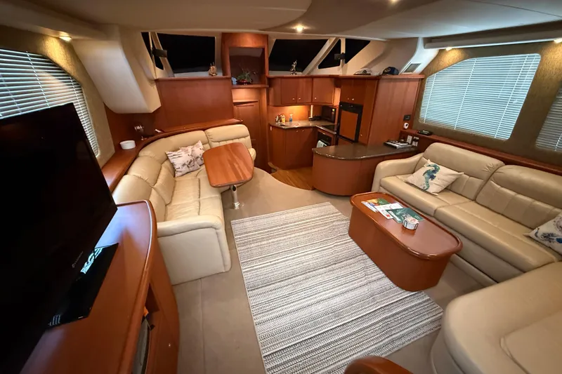 Slide: The Image of Luxurious interior of a 2005 Silverton 43 Motor Yacht with elegant seating and modern amenities. - 24
