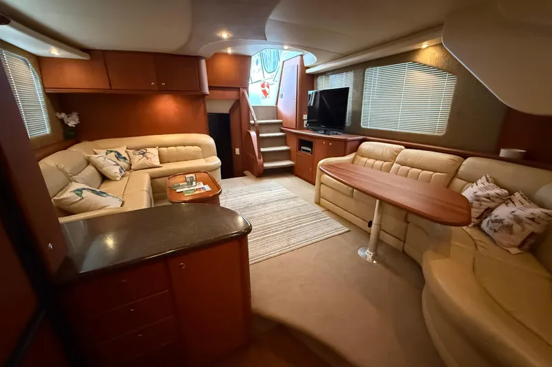 Slide: The Image of Luxurious interior of 2005 Silverton 43 Motor Yacht with plush seating and elegant decor. - 28