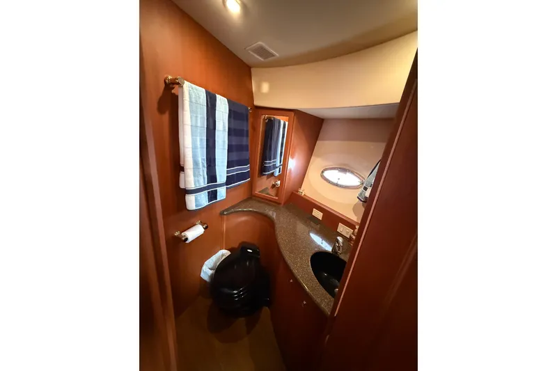Slide: The Image of Luxurious bathroom in 2005 Silverton 43 Motor Yacht with wood accents and modern fixtures. - 30