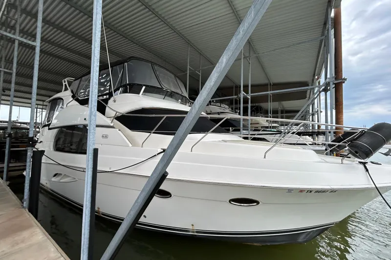 Slide: The Image of 2005 Silverton 43 Motor Yacht docked in covered marina. - 8