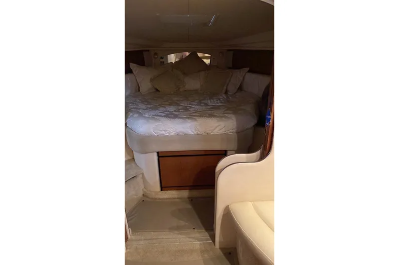 Slide: The Image of Luxurious cabin interior of 2002 Sea Ray 360 Sundancer yacht with cozy bedding. - 7