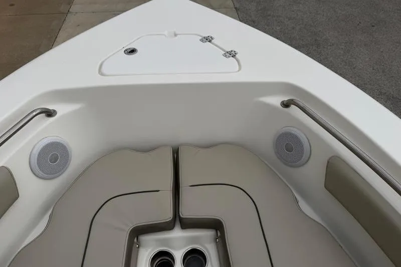 Slide: The Image of 2024 Key West 203 FS boat interior with cushioned seating and speakers. - 19