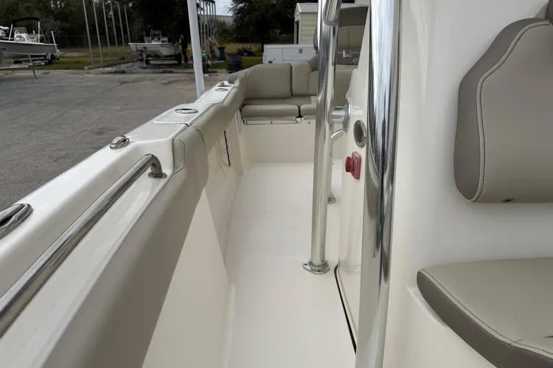 Slide: The Image of 2024 Key West 203 FS boat interior with seating and stainless steel railings. - 22