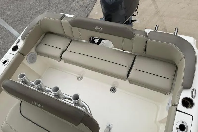 Slide: The Image of 2024 Key West 203 FS boat interior with cushioned seating and rod holders. - 35