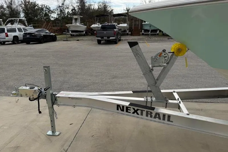 Slide: The Image of 2024 Key West 203 FS boat on NexTrail trailer in parking lot. - 42